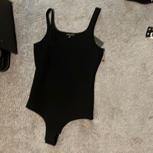 Black bodysuit never worn. Shine star brand, size medium